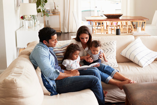 Family sitting together on the couch